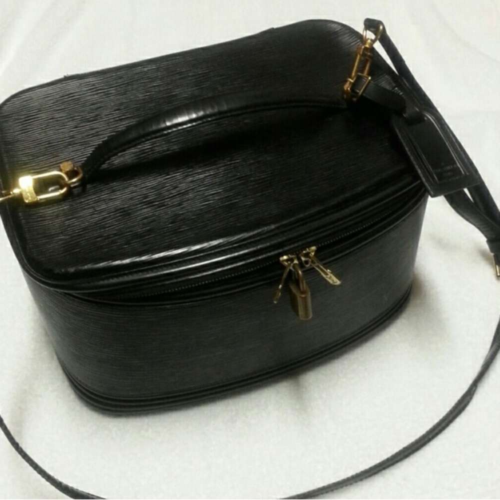 Authentic vintage Epi Louis Vuitton travel vanity case with crossbody strap.